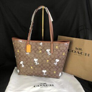 Coach X Peanuts City Tote In Signature Canvas With Snoopy Woodstock Print